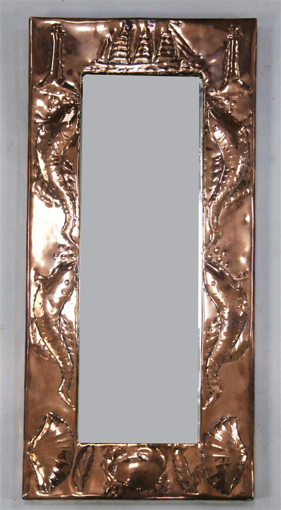 An Arts & Crafts Newlyn style rectangular copper wall mirror, 28.75 x 14.25in.